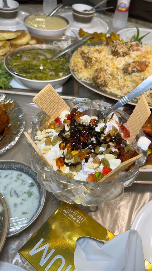 Assorted Indian dishes including chaat, biryani, and curries served on a banquet table.