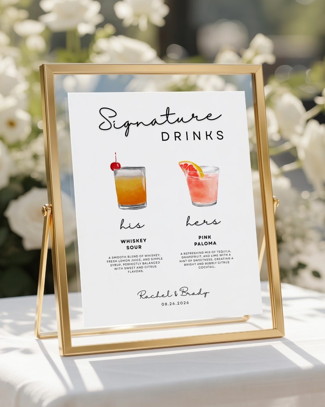 Gold framed signature drinks sign featuring illustrations of a whiskey sour and pink paloma.