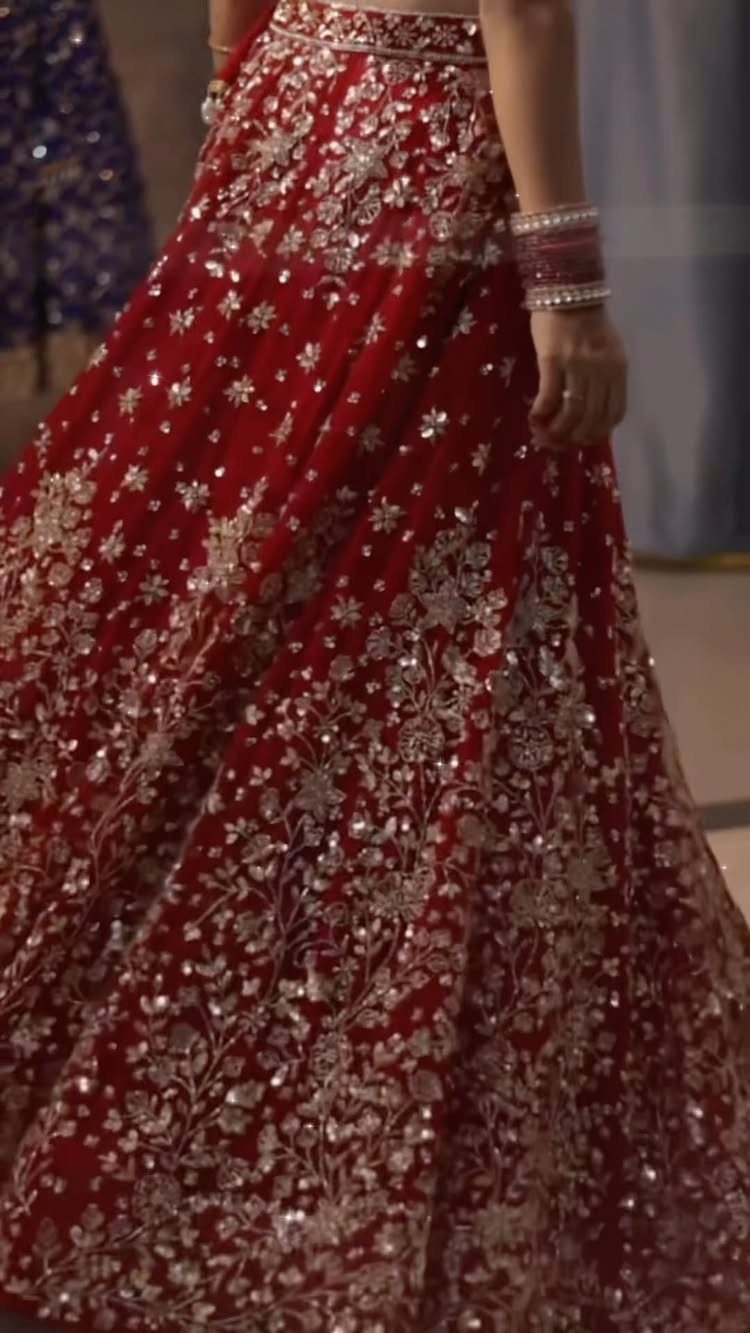 Red lehenga skirt with detailed gold and silver floral embroidery and sequins