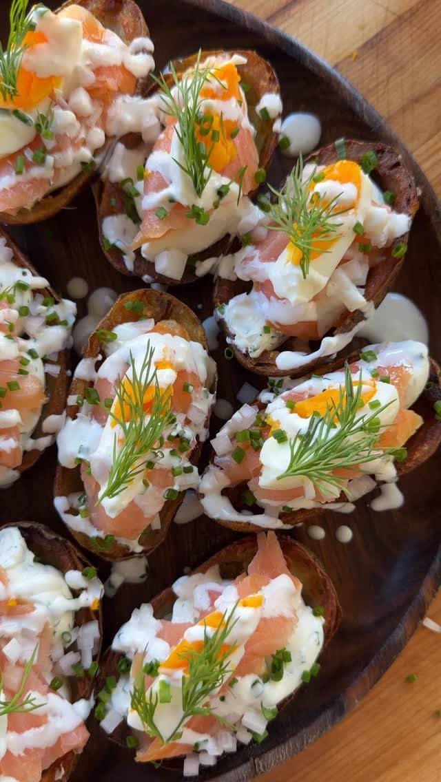 Potato skins filled with smoked salmon, cream cheese, egg, and fresh dill herbs.